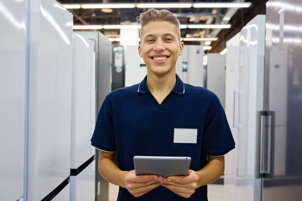 istock Friendly and approachable Sales Associate working in an Appliance Store with a handy Tablet device 2201717723