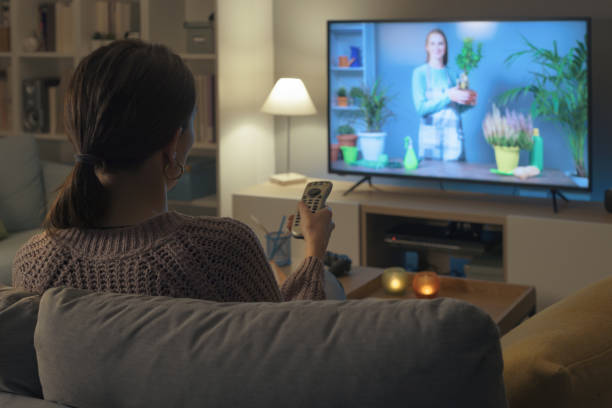 istock Woman watching a TV show about gardening 2201719641