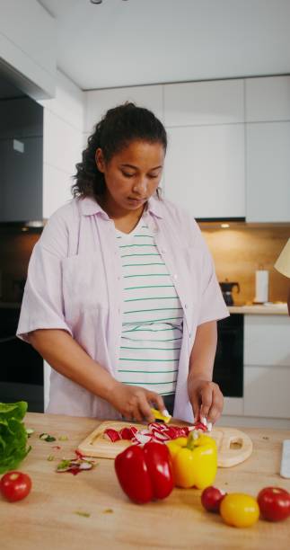 istock Mom and daughter cook in the kitchen 2201719655