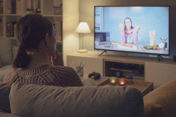 istock Woman watching a cooking show on TV 2201720034