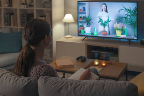 istock Woman watching a TV show about gardening 2201720249