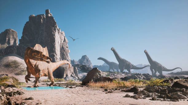 istock Dinosaurs roaming a prehistoric landscape under clear skies with mountains and water 2201723021