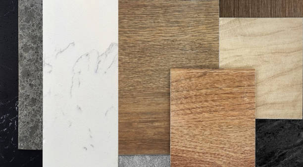 istock close up view of interior material samples board in top view including black, gray and white artificial stones, set of wooden ceramic tiles, grey carpet, black marble, wooden laminate. 2201724412