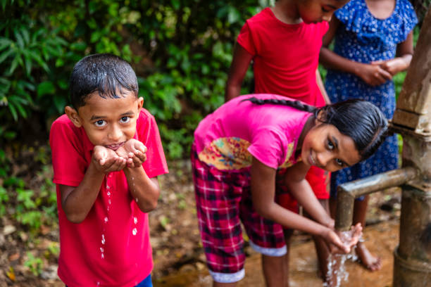 istock Sri Lankan children drinking a water, Ceylon 2201726330