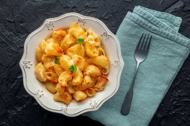 istock Mac and cheese, the classic pasta with macaroni and Cheddar cheese 2201727389