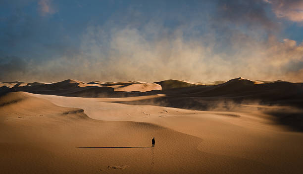 istock Man lost in desert dunes, 3D animation 2201731782