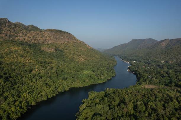 istock Aerial view of lush valley and winding river. 2201733876