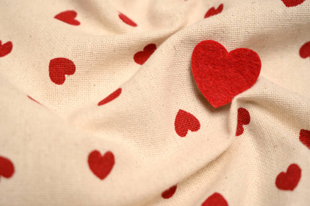 Romantic heart-patterned fabric with a cozy, soft texture. A charming backdrop for love-themed designs, greeting cards, and wedding projects.