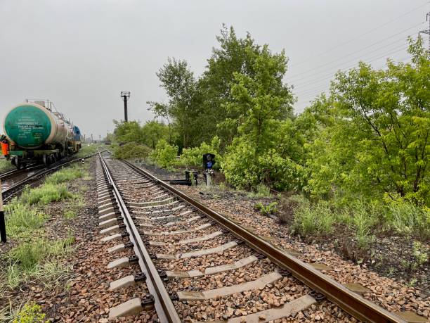 railway tracks at a railway station in summer in Kazakhstan during daytime Semey city, Eastern Kazakhstan 10.05.2024: railway tracks with sulfuric acid tanks at a railway station in summer in Kazakhstan during the daytime railroad track concrete railway sleeper thoroughfare stock pictures, royalty-free photos & images