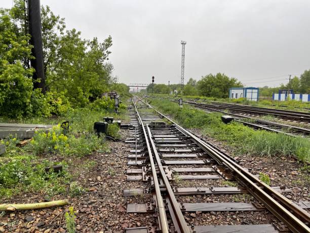 railway tracks at a railway station in summer in Kazakhstan during daytime Semey city, Kazakhstan 05.10.2024: railway tracks at a railway station in summer in Kazakhstan during daytime railroad track concrete railway sleeper thoroughfare stock pictures, royalty-free photos & images