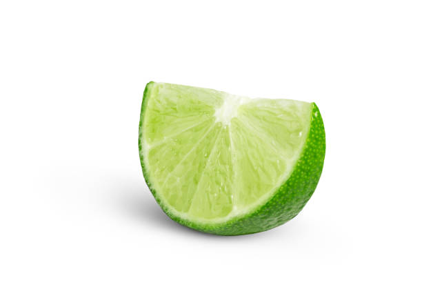 istock Slice of green lime citrus fruit isolated. Lime wedge with shadow 2201735855