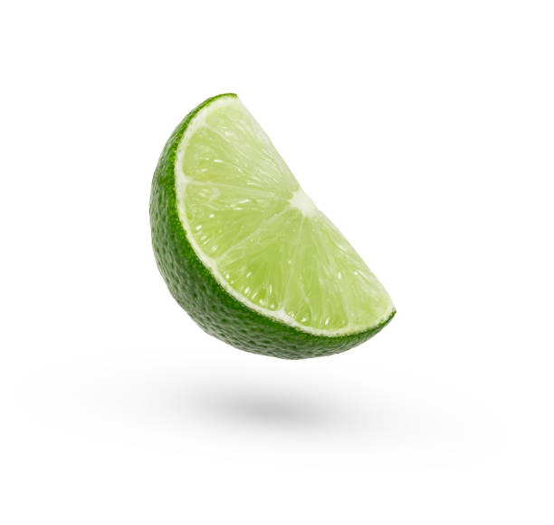 A slice of Levity lime floating in the air isolated