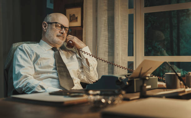 istock Vintage style journalist having a phone call 2201736534