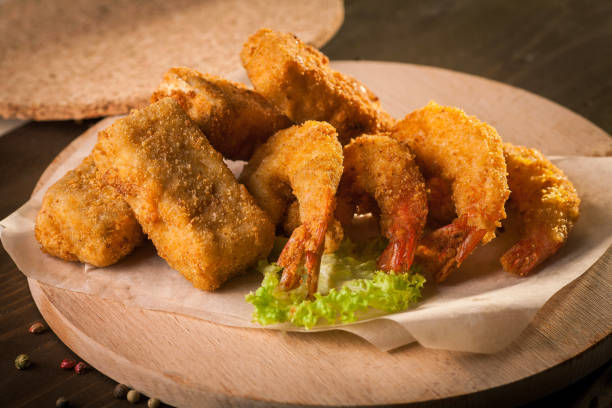 istock Deep Fried Shrimps on wooden board and baking paper 2201737587