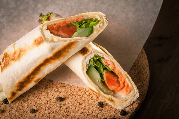 istock Salmon tortilla on baking paper with peppercorns 2201737616