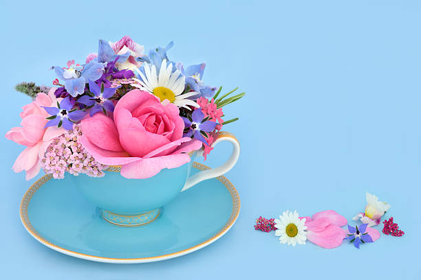istock Whimsical Summer Flower Arrangement in Blue Tea Cup 2201737672