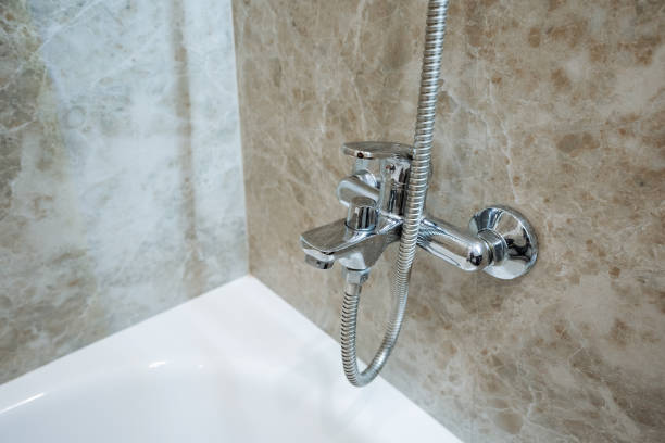 istock A welldesigned bathroom features a spacious bathtub with an overhead shower head, providing users the flexibility to enjoy both bathing and showering at their convenience 2201737861