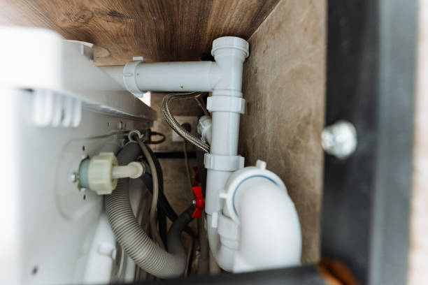istock This image shows a detailed closeup of a pipe located under a kitchen sink, highlighting various plumbing components and connections essential for proper kitchen functionality 2201737877