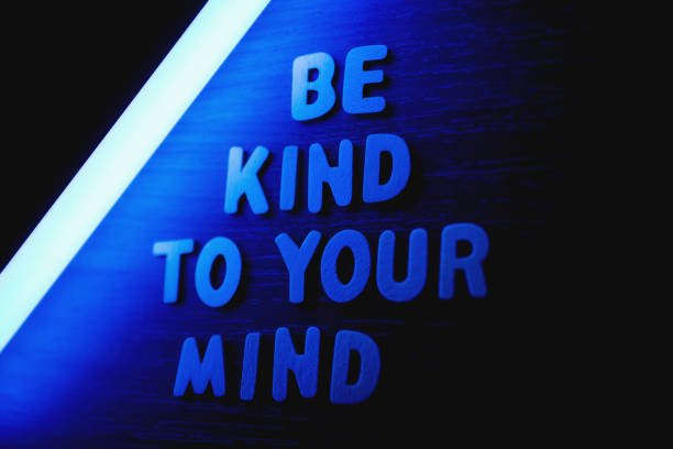 Be kind to your mind - Wooden letters with blue neon lightning