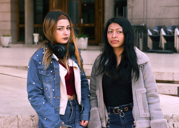 istock Friends posing for a picture outdoors in a modern urban setting 2201741699