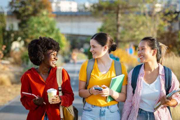 istock Diverse female students using their phones in the city 2201743781