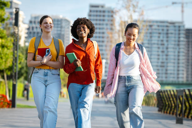 istock Three young women enjoying a city walk on a sunny day 2201743786