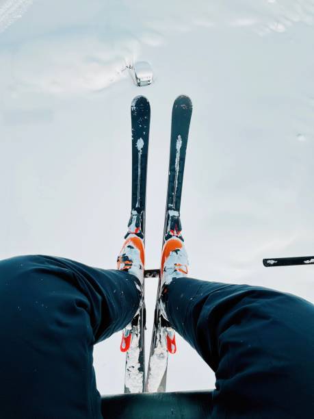 winter in the mountains of Greece, skis on the snow and the shadow of a pine tree