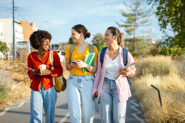 istock Diverse female students using their phones in the city 2201744955