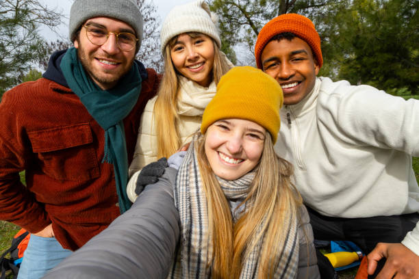 istock Happy friends taking selfie outdoors in winter clothes 2201747284