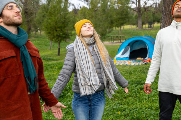 istock Friends breathing fresh air in campground holding hands 2201747322