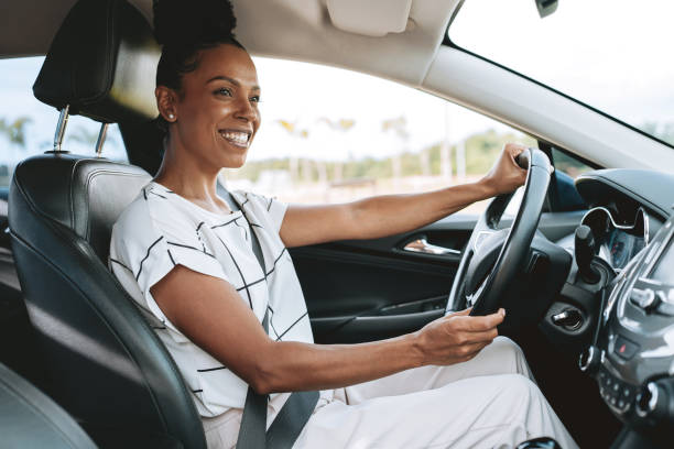 istock Woman driver confidently driving a modern car in the city 2201747509