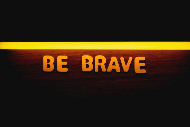 Be brave - Wooden letters with orange neon lightning