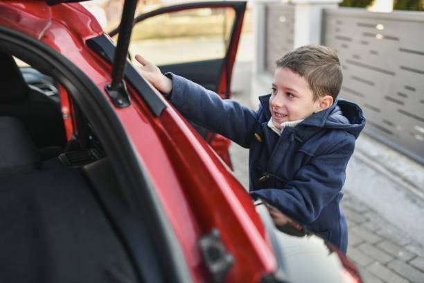Child Getting Into Red Car in a Quiet Suburban Area