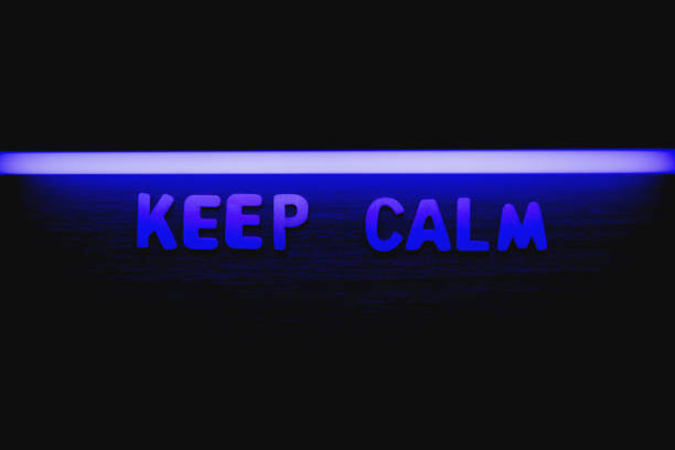 Keep calm - Wooden letters with blue neon lightning