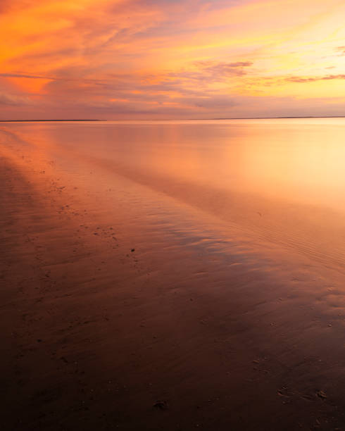 Setting sun sets ablaze an evening sky on above Jekyll, Island, GA