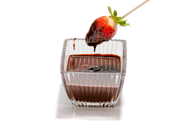 istock A bowl of chocolate sauce with a strawberry on a stick 2201754126