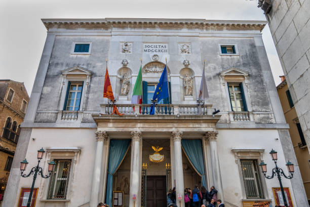 Venice, Italy - March 19, 2024 - Teatro La Fenice opera house, landmark Venetian theater with facade from 1792 by Giannantonio Selva and Neo-classical colonnade.
