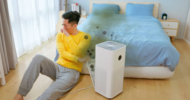 istock Male unhappy air purifier dirt 2201759082