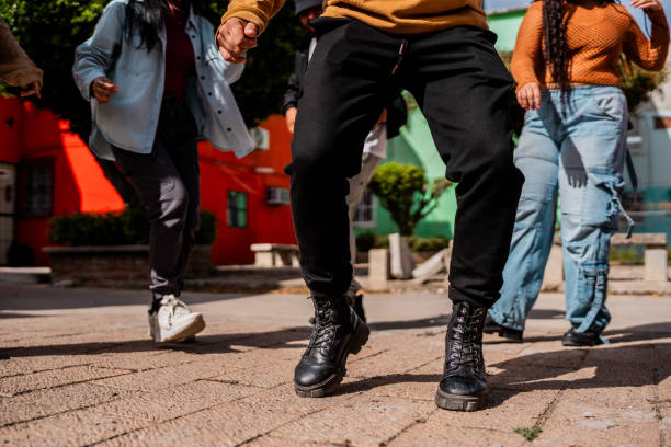 istock Low section of friends dancing outdoors 2201761165