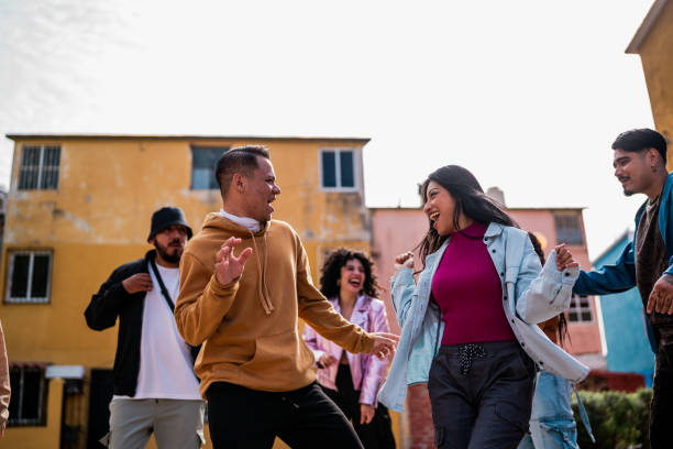 istock Young friends dancing outdoors 2201761405