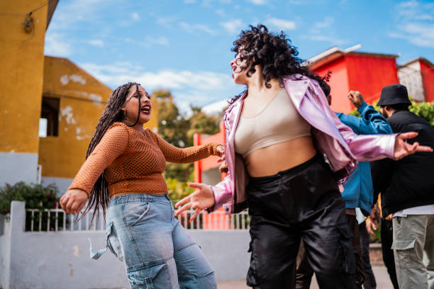 Young women dancing outdoors