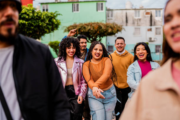 istock Young friends walking and talking outdoors 2201762294