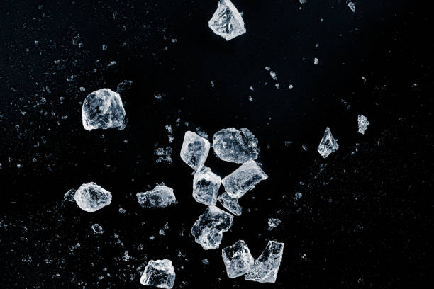istock Ice, crushed on a black background. Shards of crushed ice. 2201764151