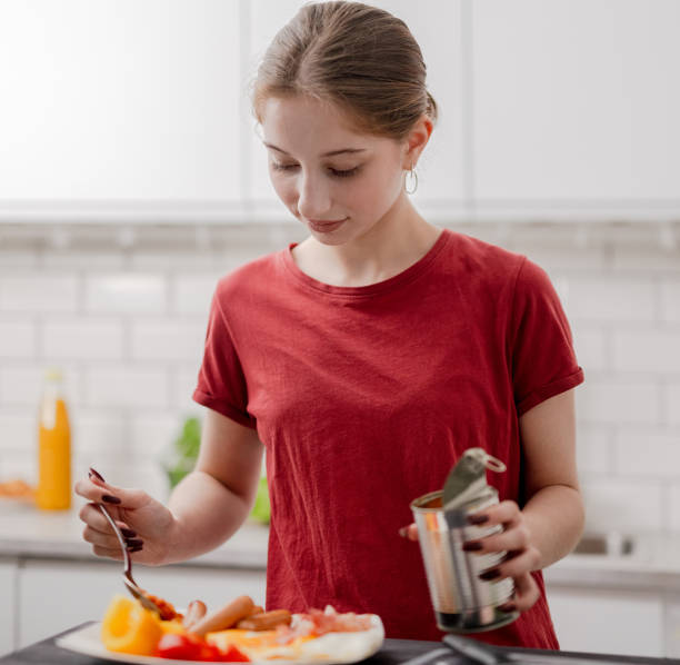 Young Girl Makes Breakfast