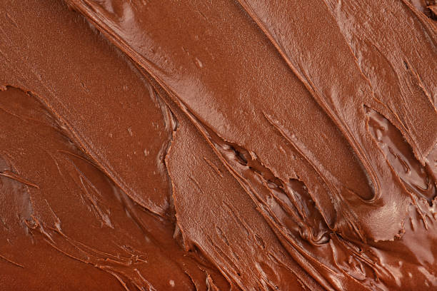 istock Melted chocolate cream as background, top view. Hazelnut cream, chocolate smear. 2201769470