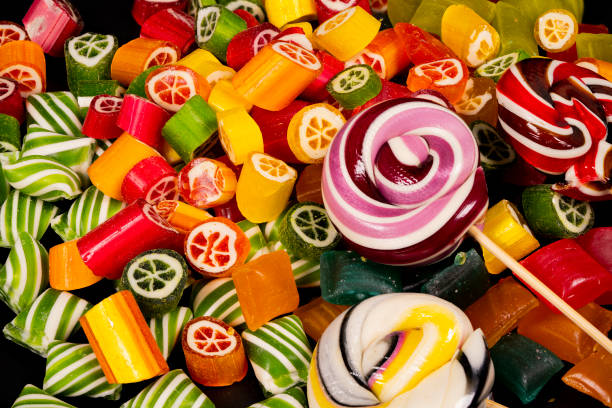 Colorful candy assortment featuring lollipops and gummy treats