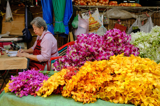 Bangkok, Thailand - February 15 2025: Flower seller from Bangkok market