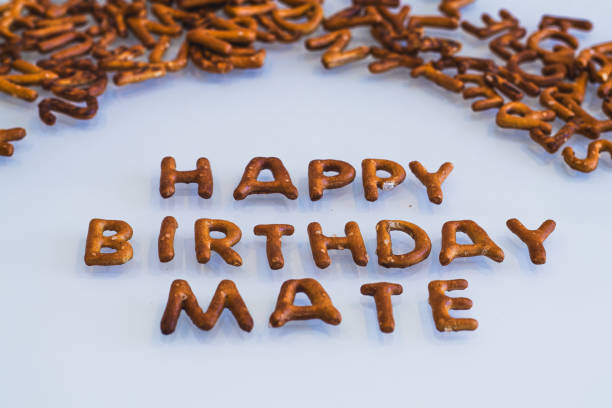 Colour image of baked letters arranged as mate