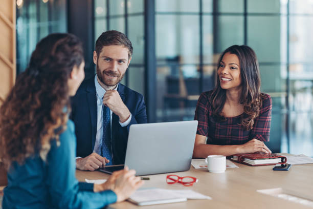 istock Group of business persons working together in the office 2201781843