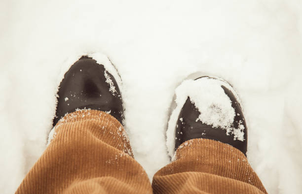 istock legs in snow close up overhead view 2201782655